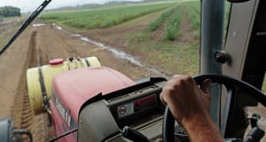 Field seen through tractor window.